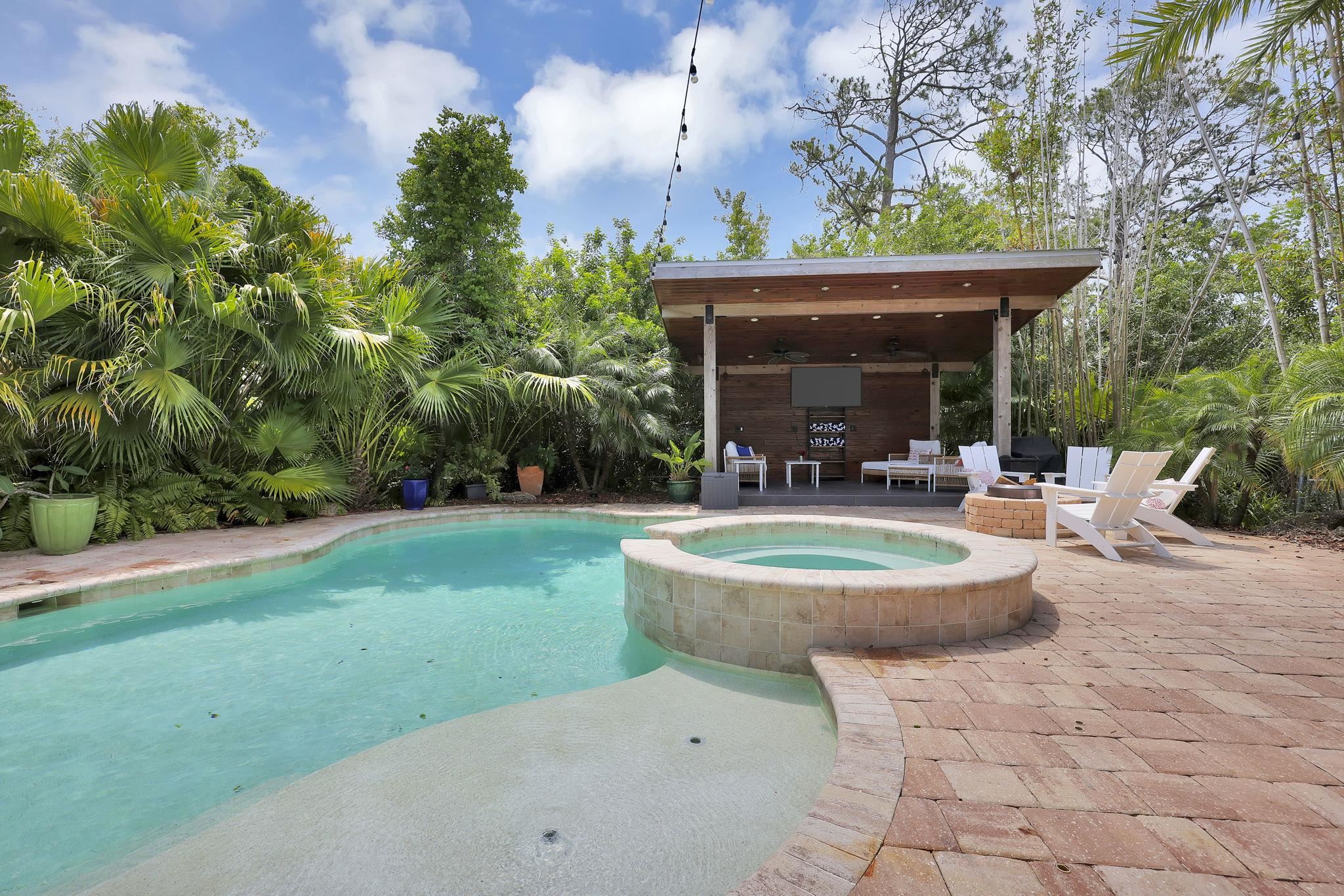 311 Weff Road St. Augustine, FL 32080 - Photo 41 of 65 a backyard of a house with fountain table and chairs