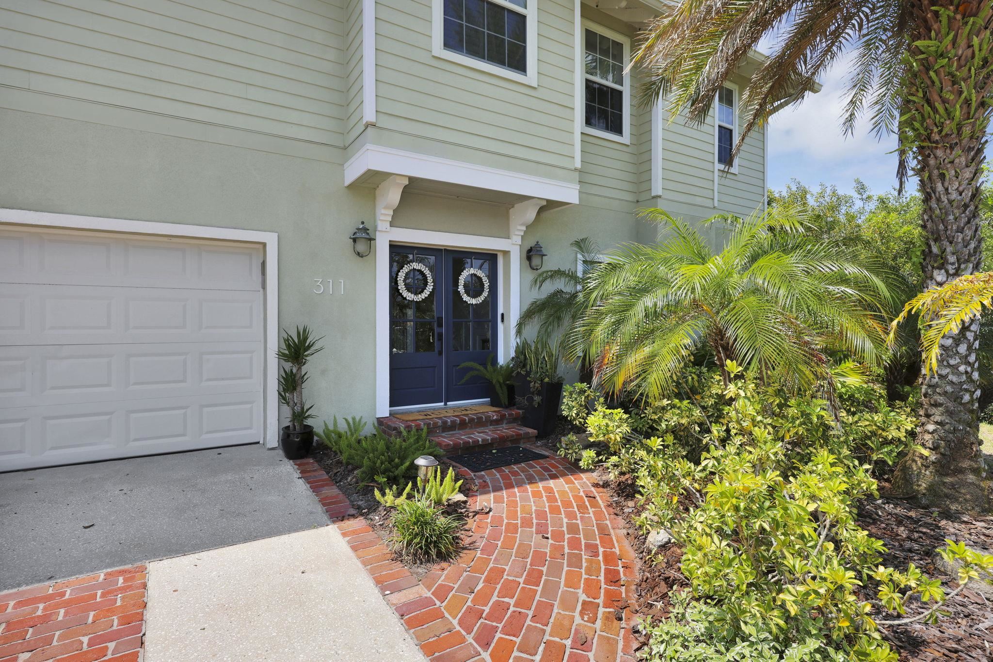 311 Weff Road St. Augustine, FL 32080 - Photo 47 of 65 a front view of a house with garden