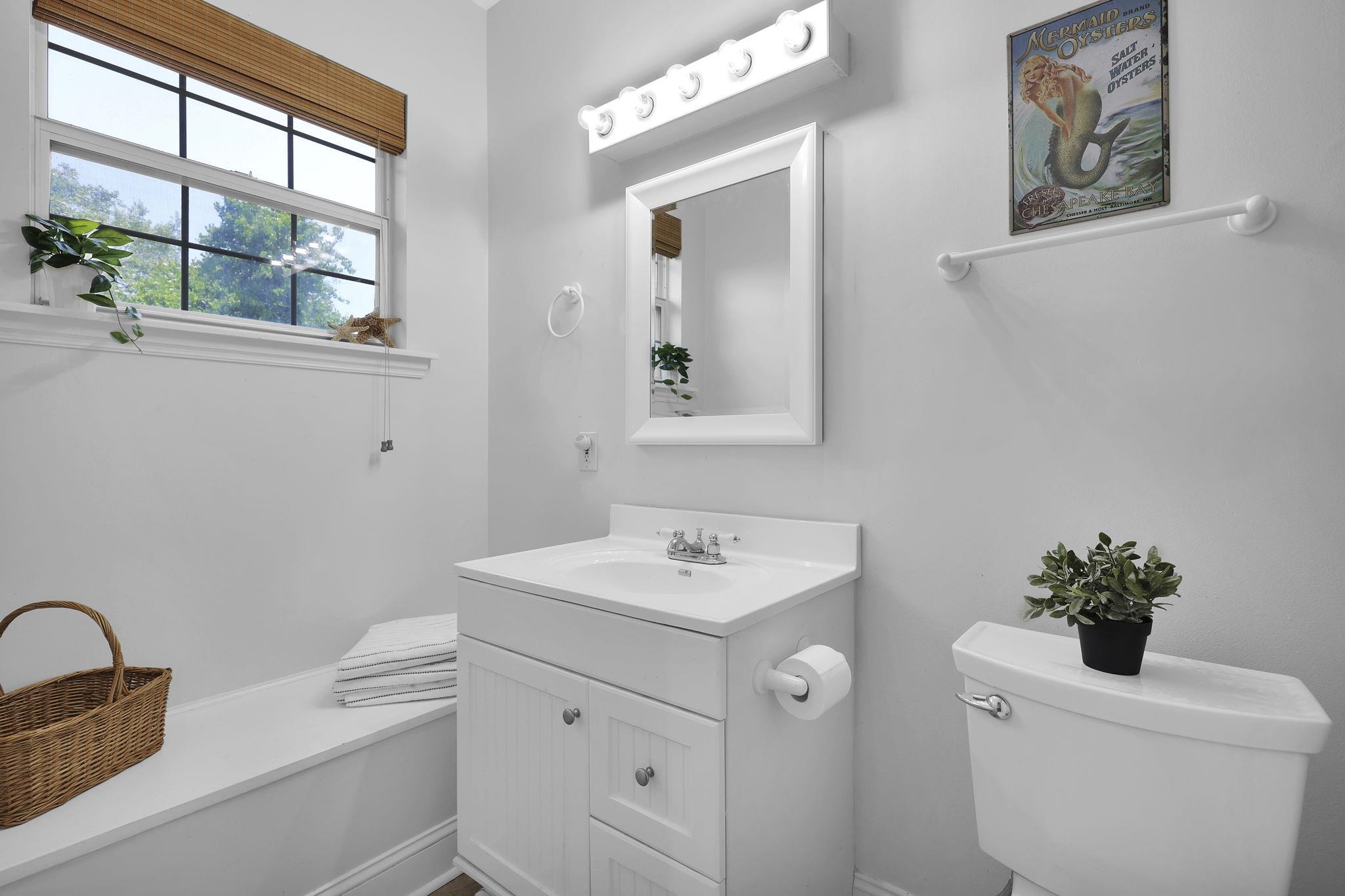 311 Weff Road St. Augustine, FL 32080 - Photo 50 of 65 a bathroom with a sink a vanity and a toilet