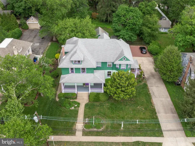 an aerial view of a house with outdoor space