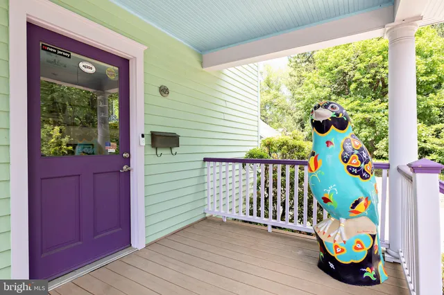 a view of a dining room with furniture and a chandelier