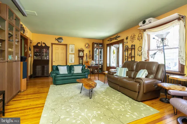 a living room with lots of furniture and a rug