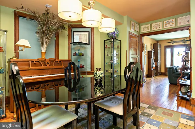 a view of a dining room with furniture and chandelier
