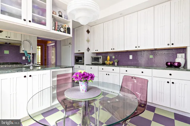 a bathroom with a toilet a sink and a window