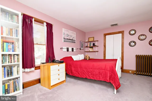 a bathroom with a sink toilet and a mirror