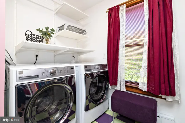 a work room with furniture and a window