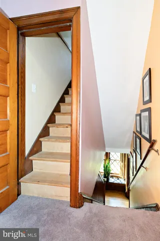 a bathroom with a granite countertop sink and mirror