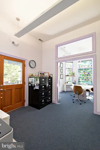 a dining room with stainless steel appliances kitchen island a table and chairs