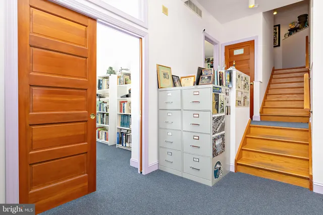 a view of a dining area with furniture and a rug