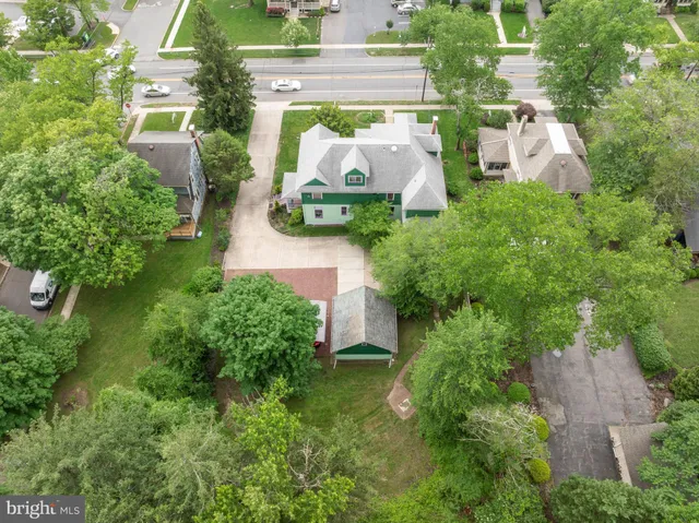 a potted plant in front of a red door