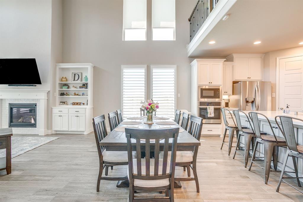 5709 Pope Creek Road Fort Worth, TX 76126 - Photo 12 of 39 The dining area is spacious, inviting, and filled with natural light from the surrounding walls of windows!