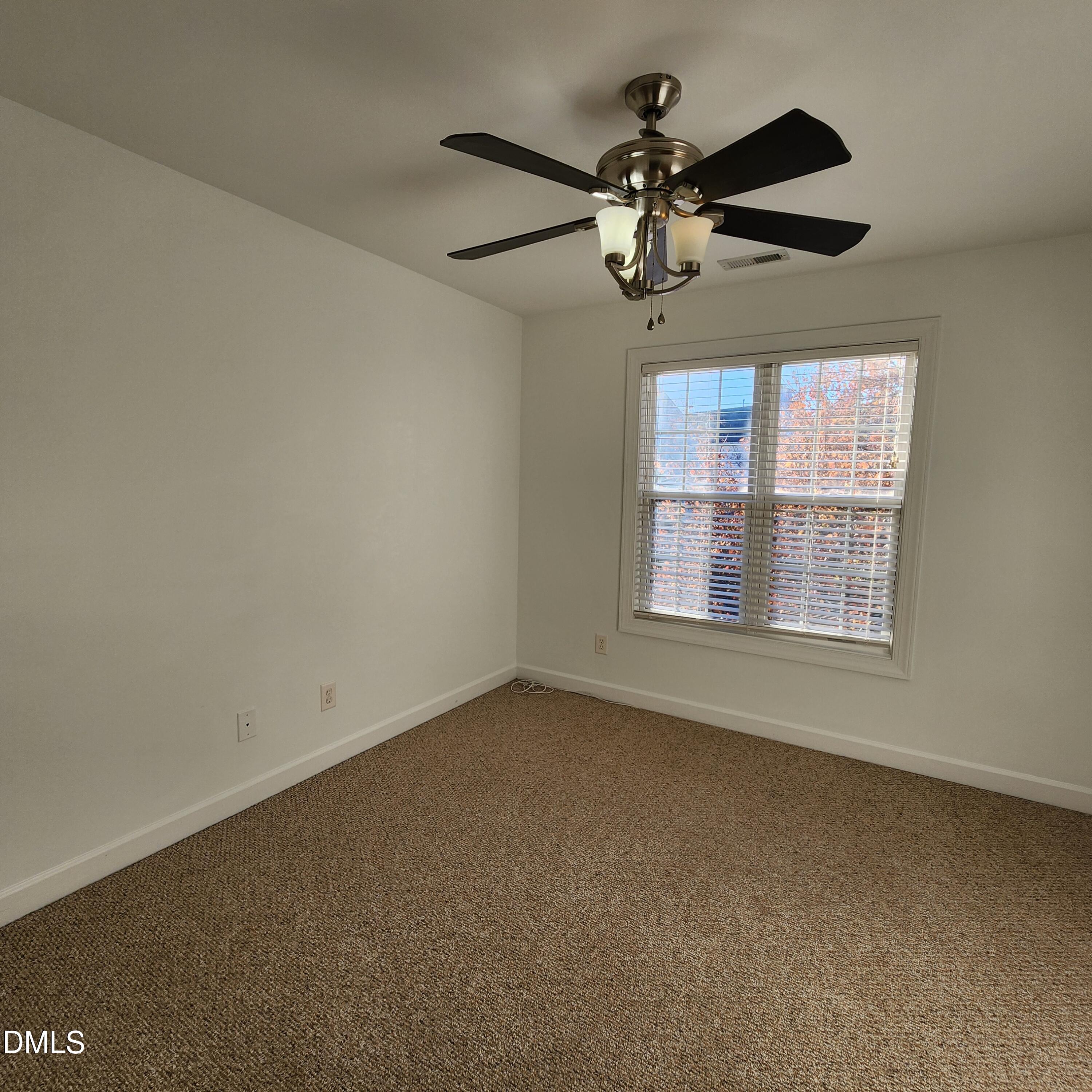 4916 Morning Edge Drive Raleigh, NC 27613 - Photo 20 of 26 a view of an empty room with a window