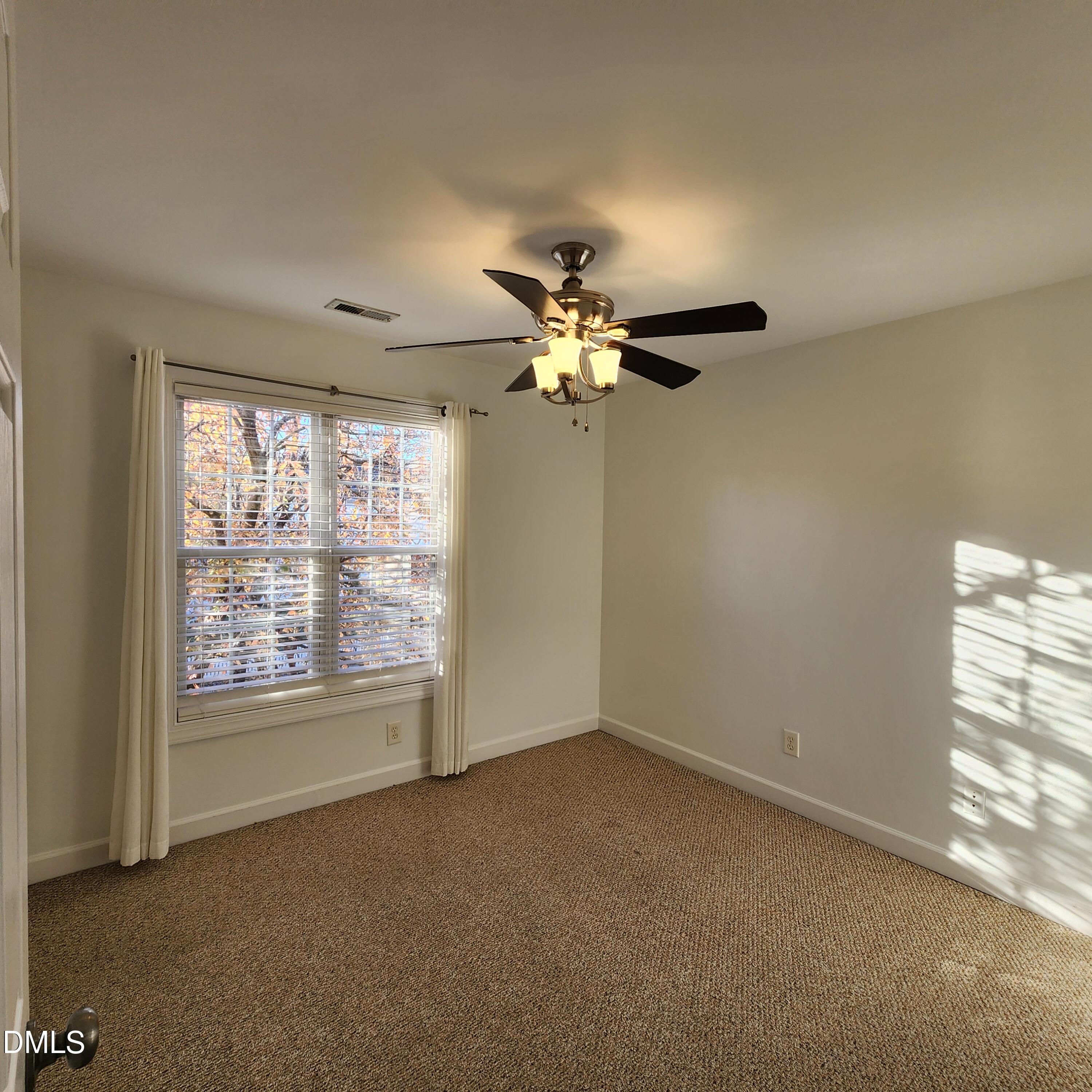 4916 Morning Edge Drive Raleigh, NC 27613 - Photo 21 of 26 a view of an empty room with a window