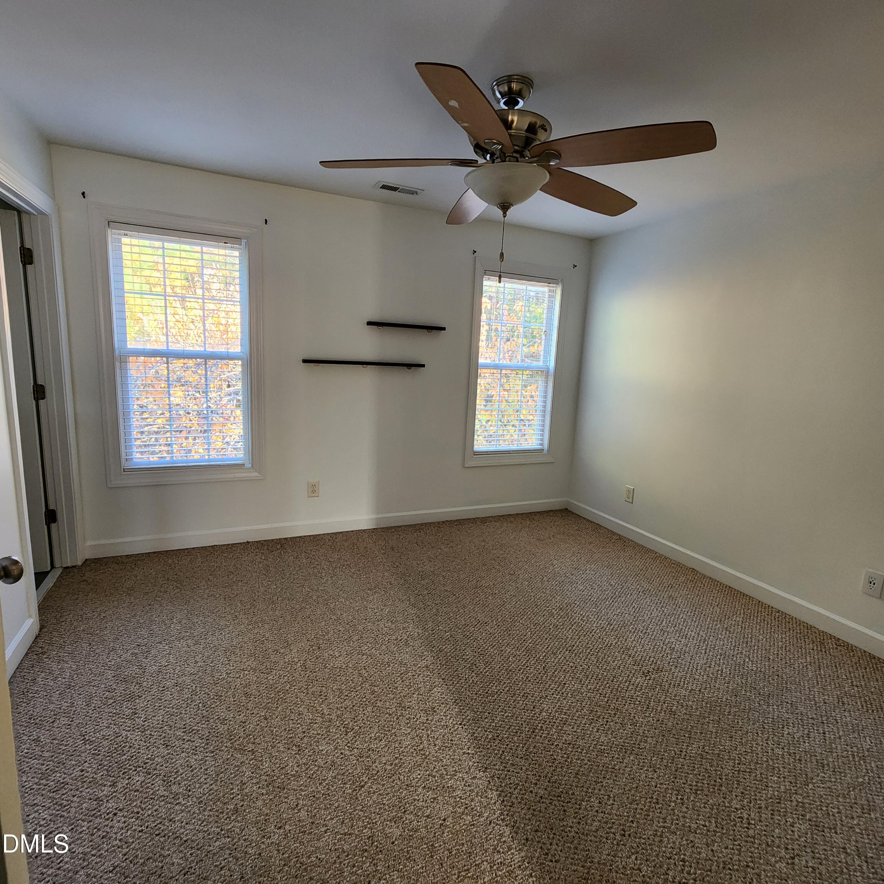 4916 Morning Edge Drive Raleigh, NC 27613 - Photo 22 of 26 a view of an empty room with a window