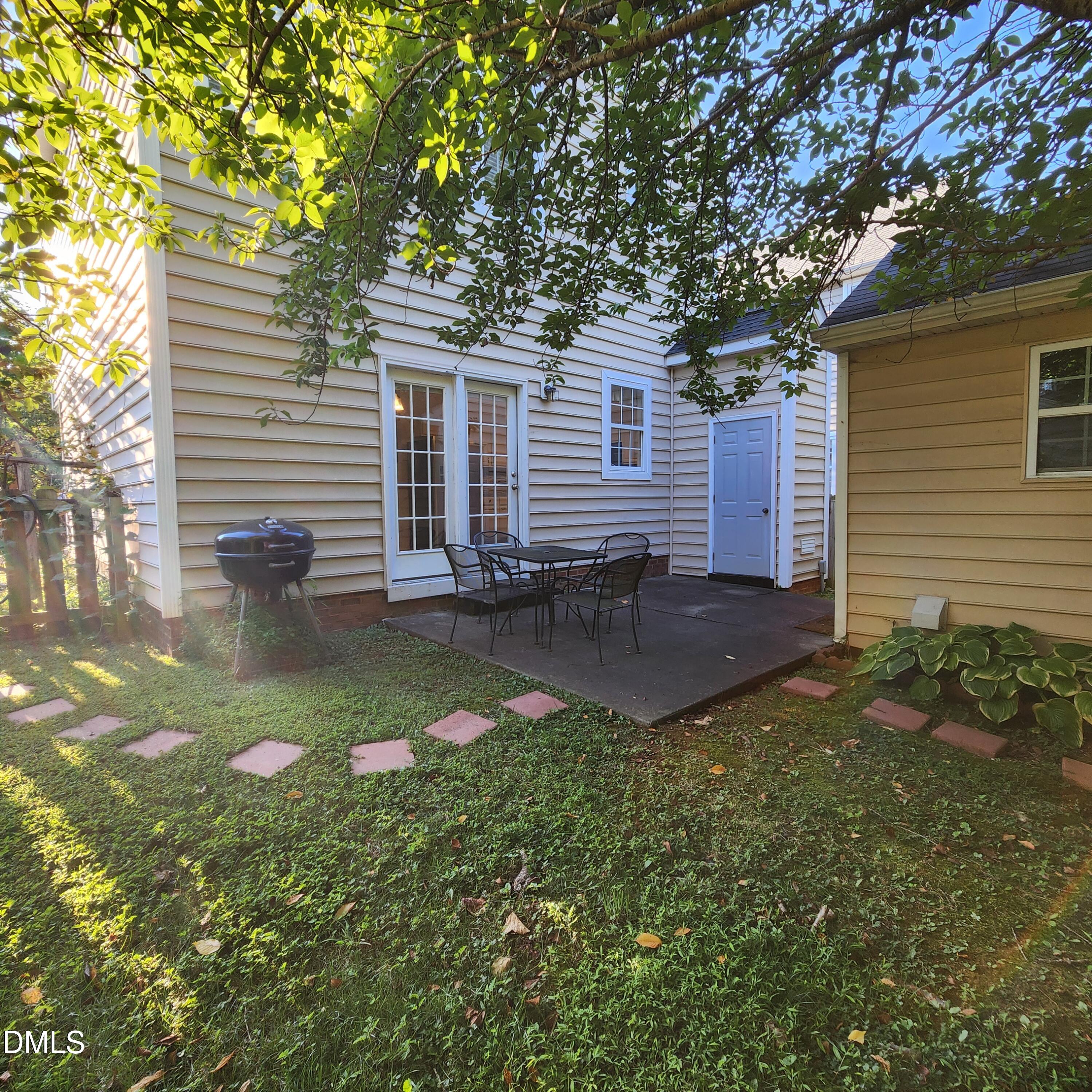 4916 Morning Edge Drive Raleigh, NC 27613 - Photo 25 of 26 a backyard of a house with seating space