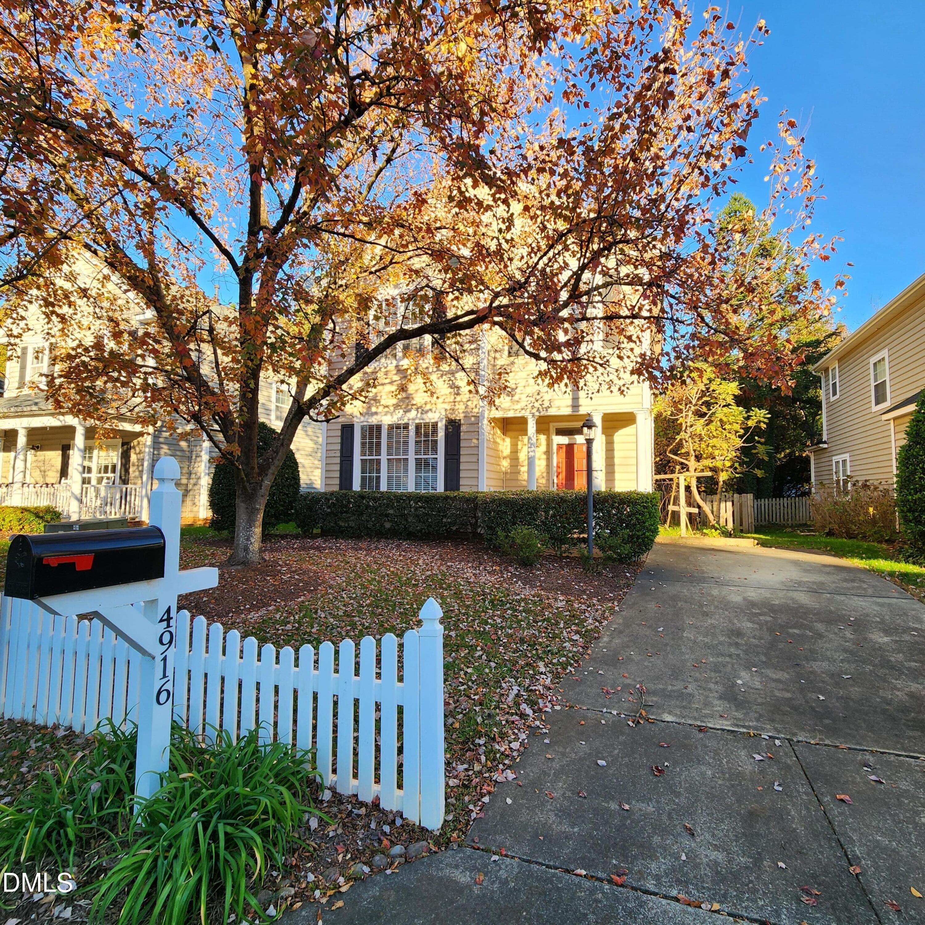 4916 Morning Edge Drive Raleigh, NC 27613 - Photo 4 of 26 a front view of a house with a garden