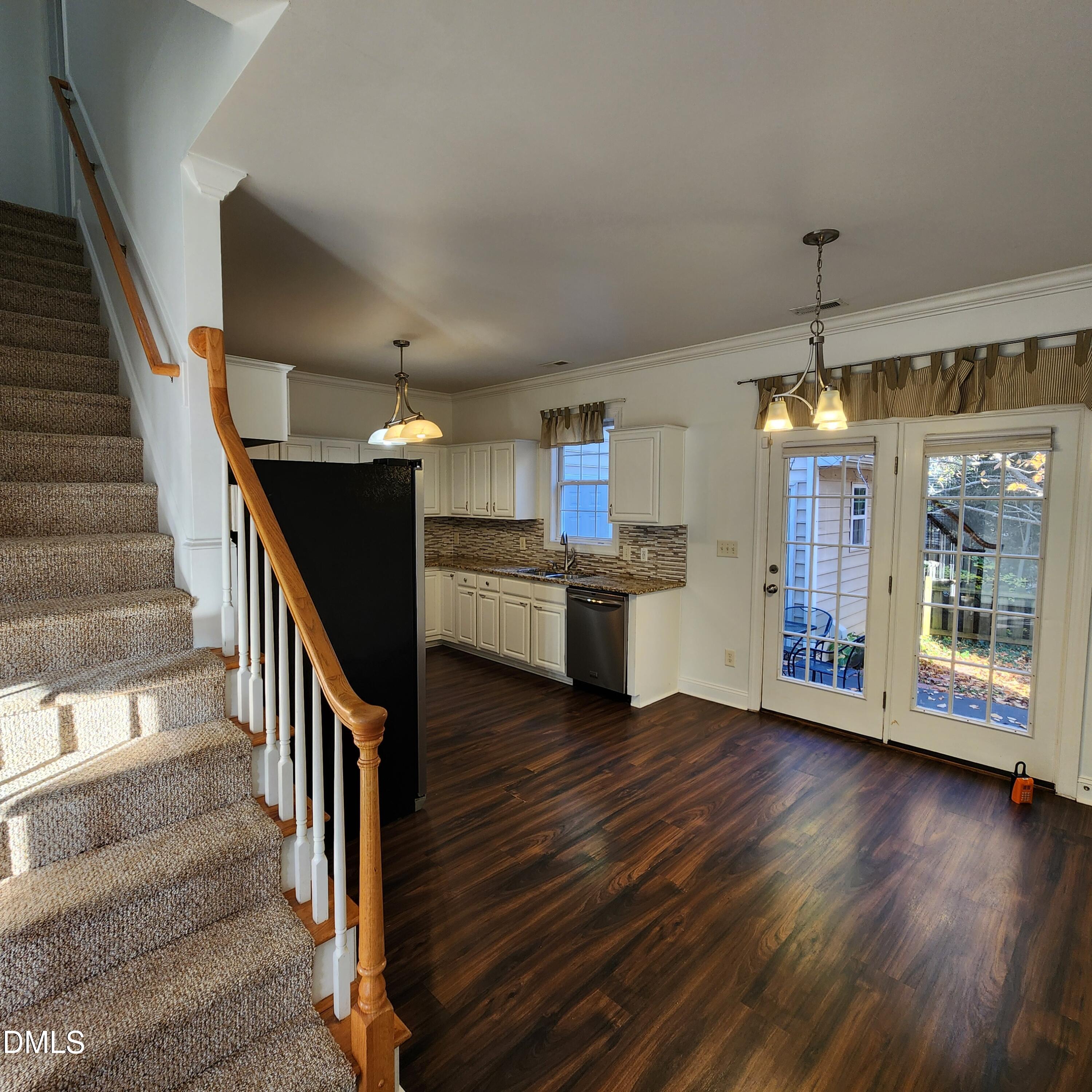 4916 Morning Edge Drive Raleigh, NC 27613 - Photo 5 of 26 a view of kitchen with furniture and wooden floor