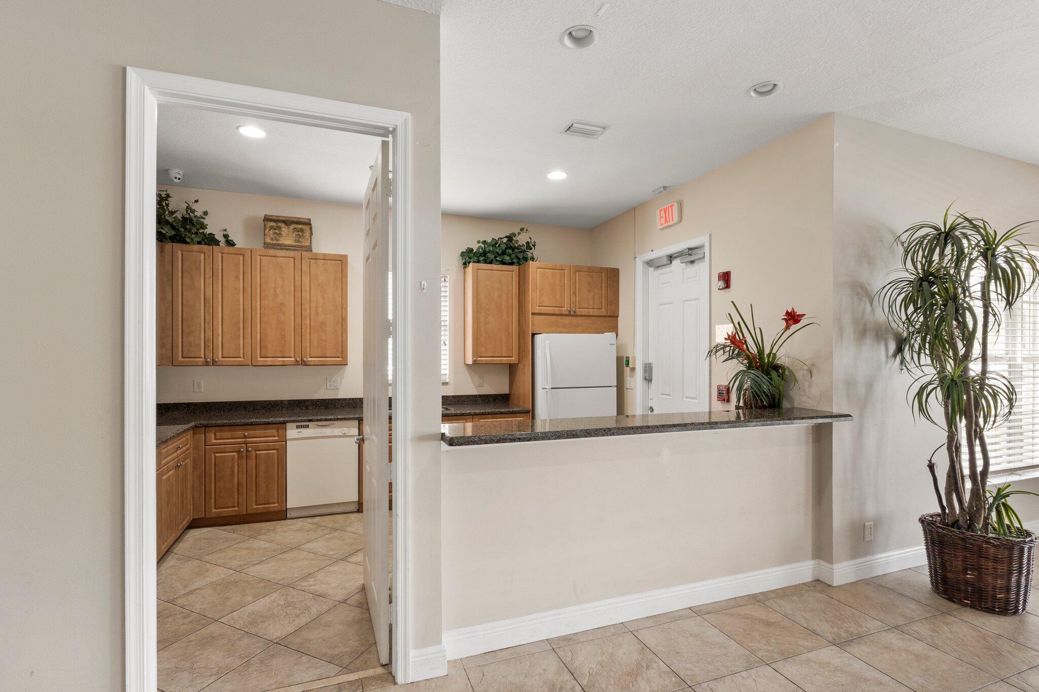 2442 Southwest Regency Road Stuart, FL 34997 - Photo 34 of 36 clubhouse kitchen