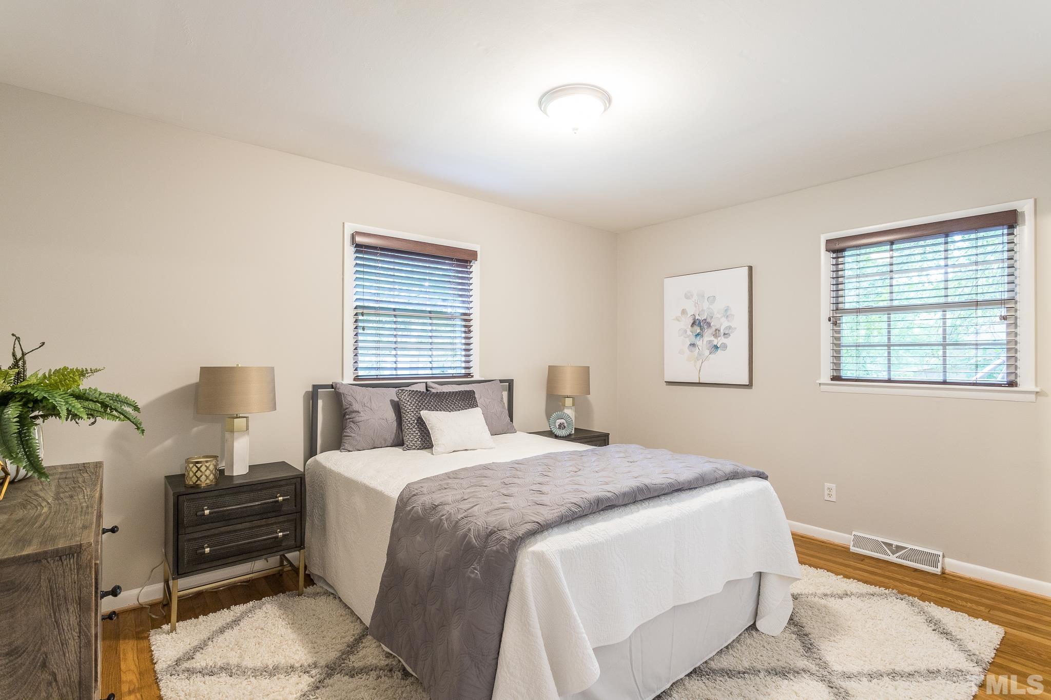636 Duke Drive Raleigh, NC 27609 - Photo 11 of 19 Master Bedroom has hardwood floors.