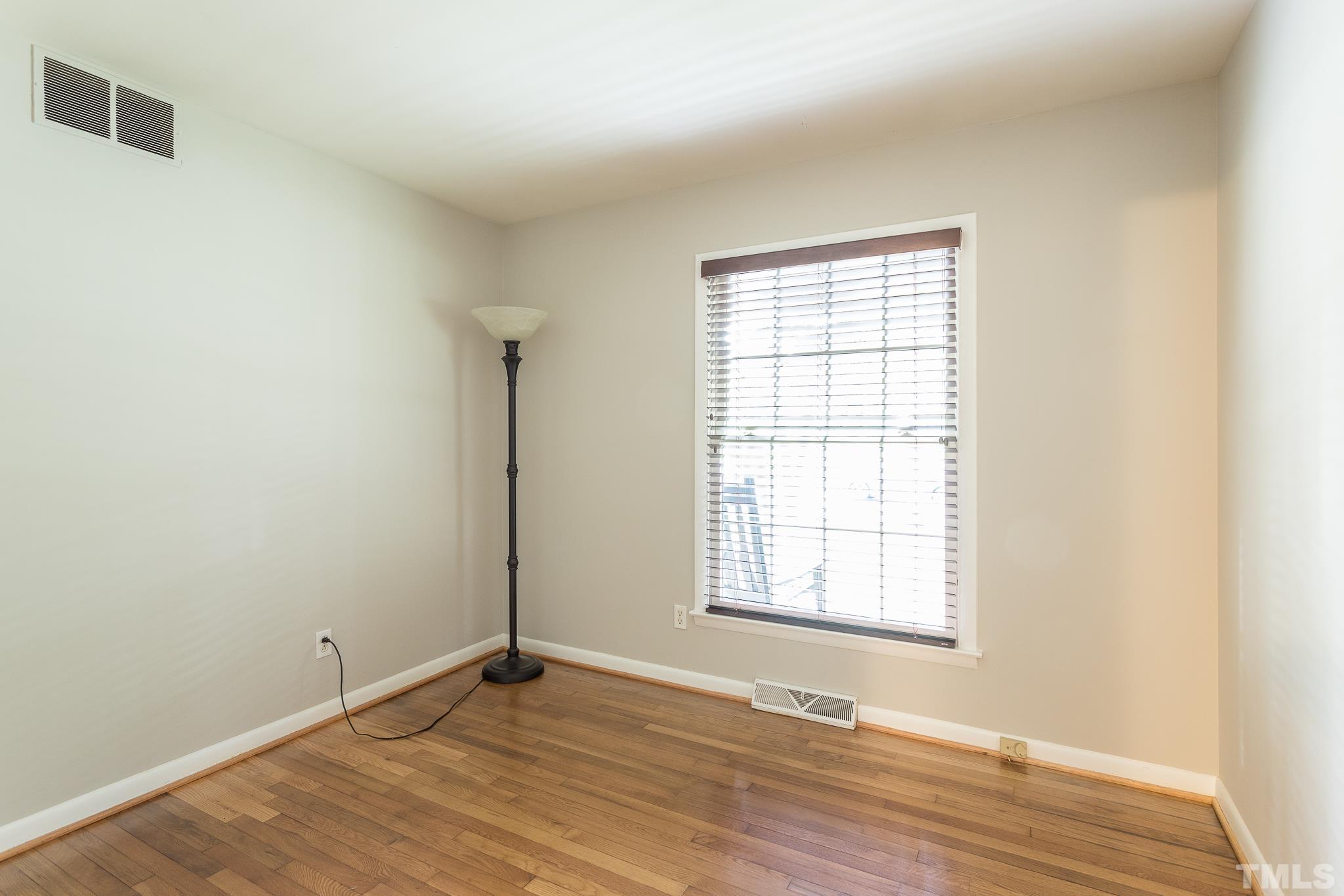 636 Duke Drive Raleigh, NC 27609 - Photo 13 of 19 Bedroom 2 has hardwood floors.