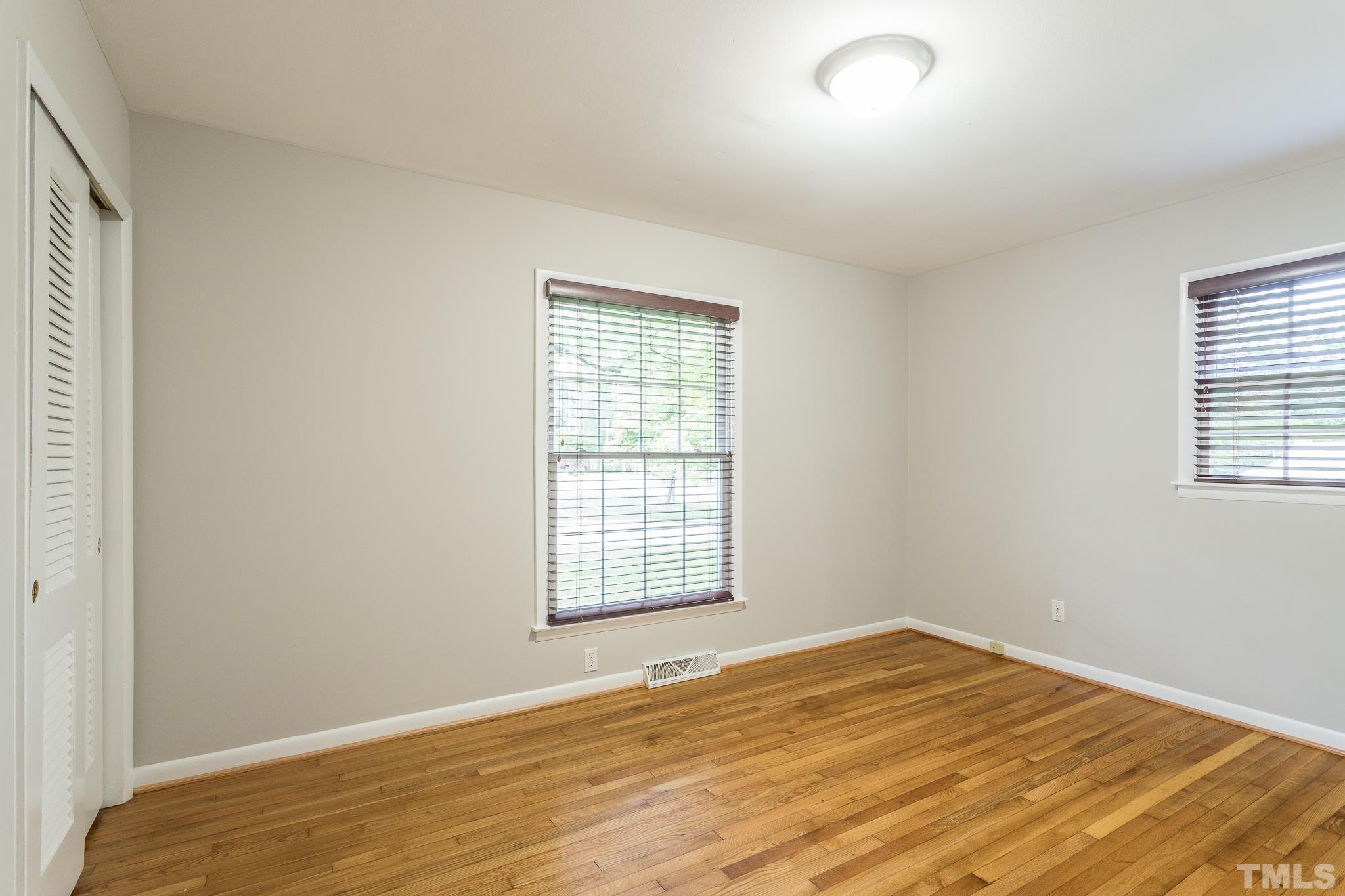 636 Duke Drive Raleigh, NC 27609 - Photo 14 of 19 Bedroom has hardwood floors