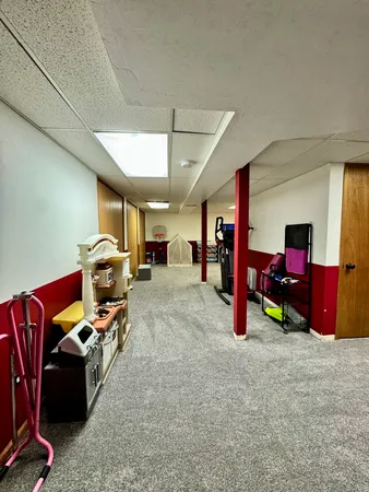 a room with furniture and musical instruments