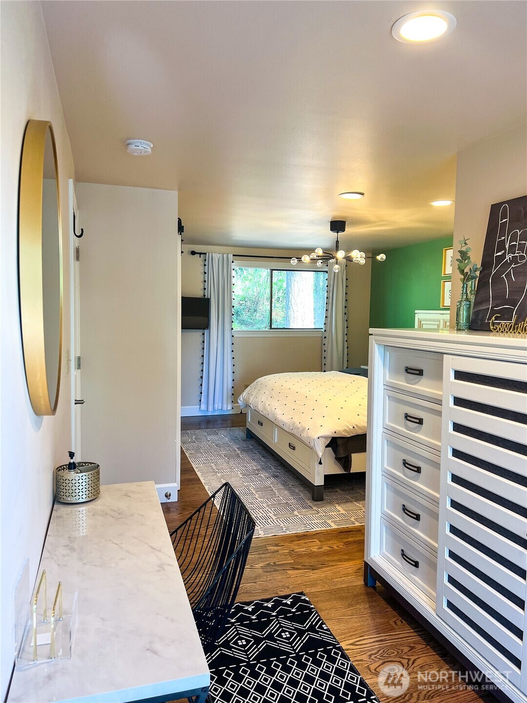 9550 132nd Avenue Southeast Renton, WA 98059 - Photo 11 of 34 a bedroom with a bed and view of living room