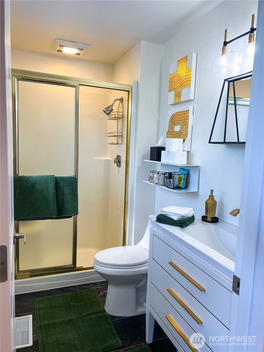 9550 132nd Avenue Southeast Renton, WA 98059 - Photo 12 of 34 a bathroom with a sink a toilet and a shower