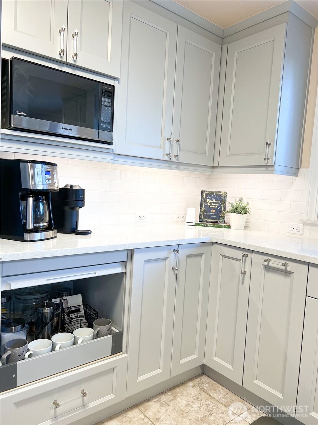 9550 132nd Avenue Southeast Renton, WA 98059 - Photo 18 of 34 a kitchen with stainless steel appliances white cabinets and a sink