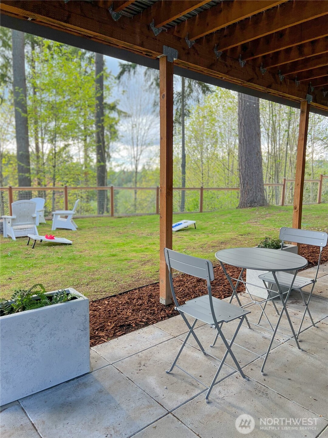 9550 132nd Avenue Southeast Renton, WA 98059 - Photo 2 of 34 a view of a backyard with furniture and garden