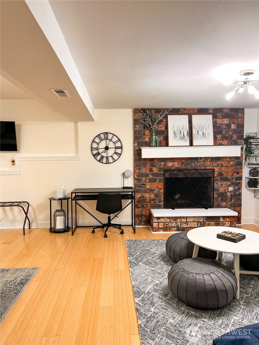 9550 132nd Avenue Southeast Renton, WA 98059 - Photo 22 of 34 a living room with furniture and a fireplace