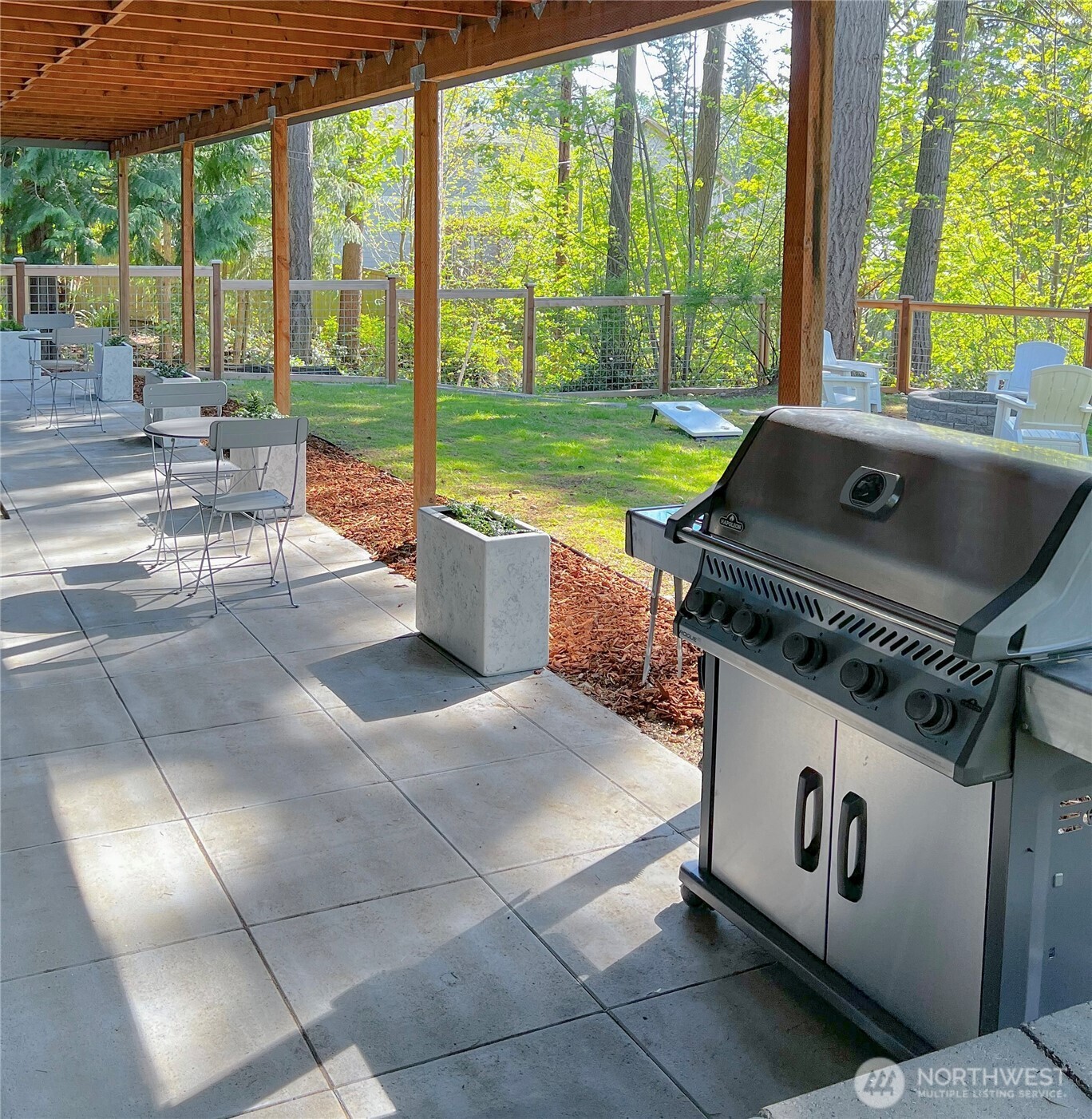 9550 132nd Avenue Southeast Renton, WA 98059 - Photo 3 of 34 a view of a patio with a table and chairs