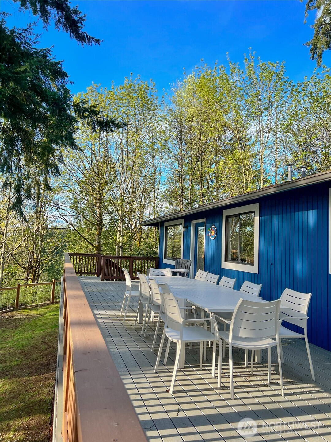 9550 132nd Avenue Southeast Renton, WA 98059 - Photo 31 of 34 a view of a patio with table and chairs with wooden floor and fence