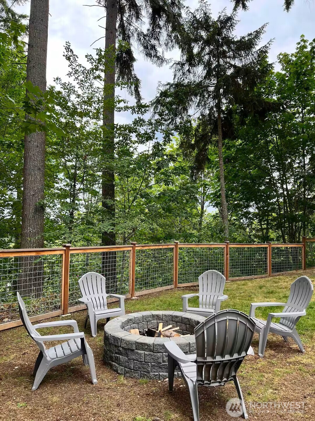9550 132nd Avenue Southeast Renton, WA 98059 - Photo 32 of 34 a view of a chair and tables in the roof deck