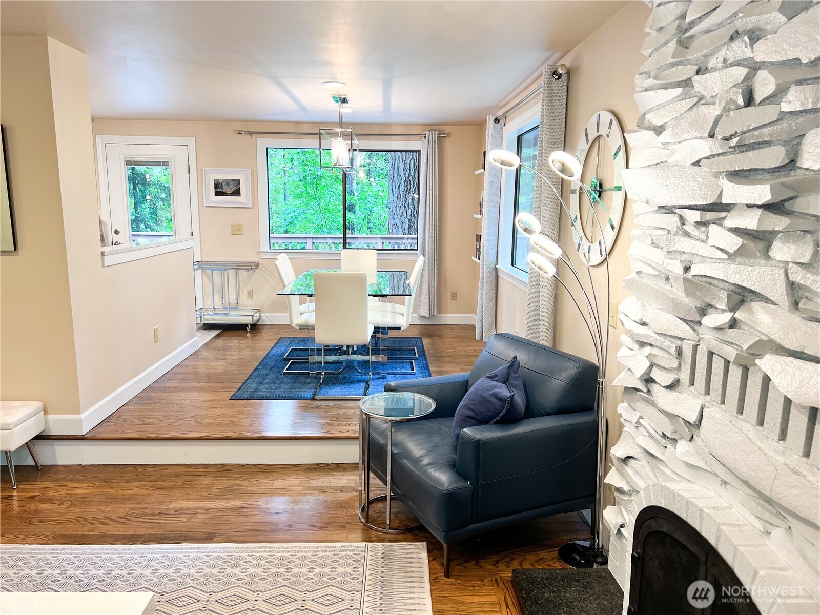 9550 132nd Avenue Southeast Renton, WA 98059 - Photo 5 of 34 a living room with furniture and a fireplace