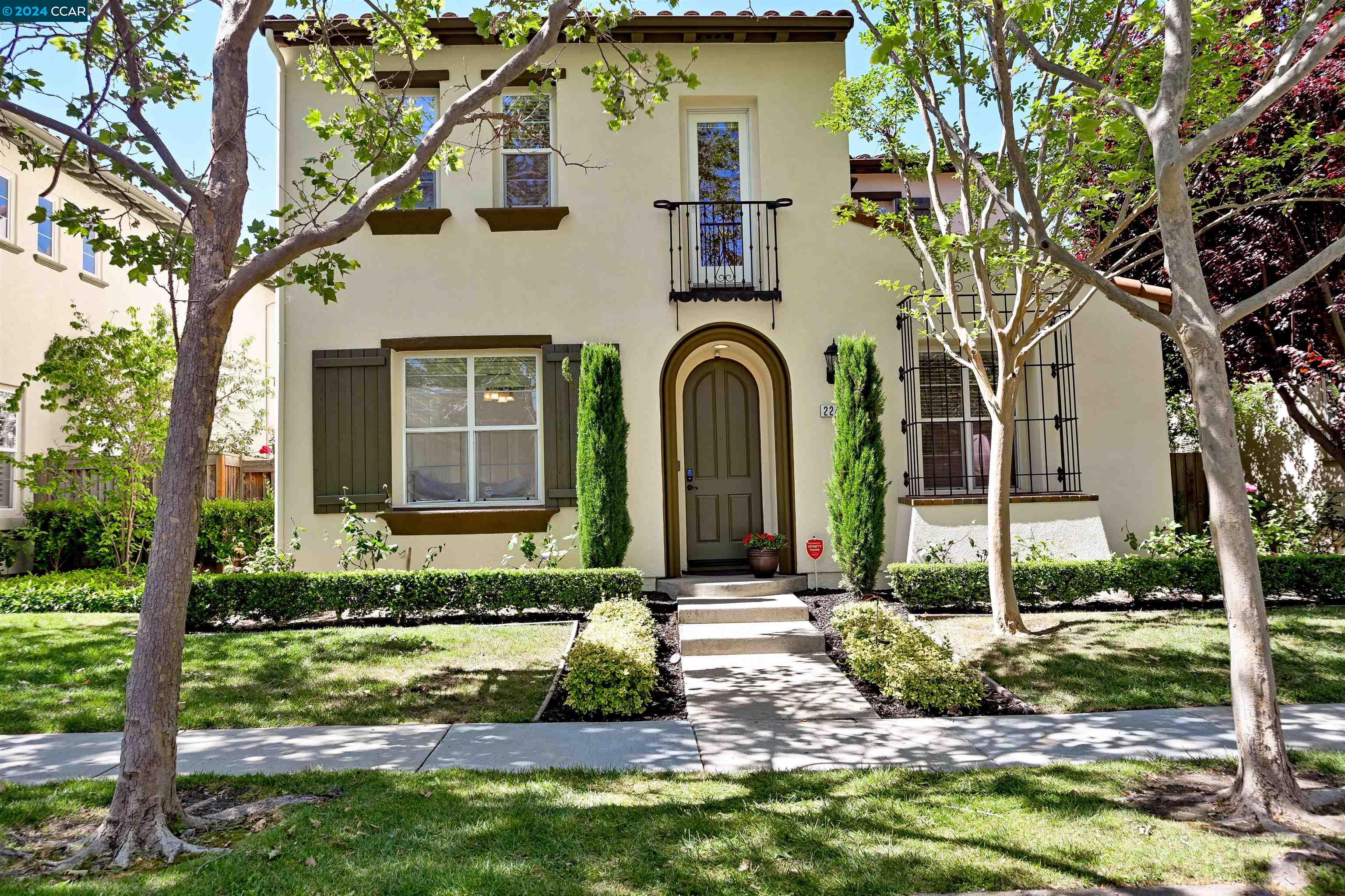 a front view of a house with garden