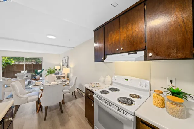 a view of a dining room with furniture window and flowerpot