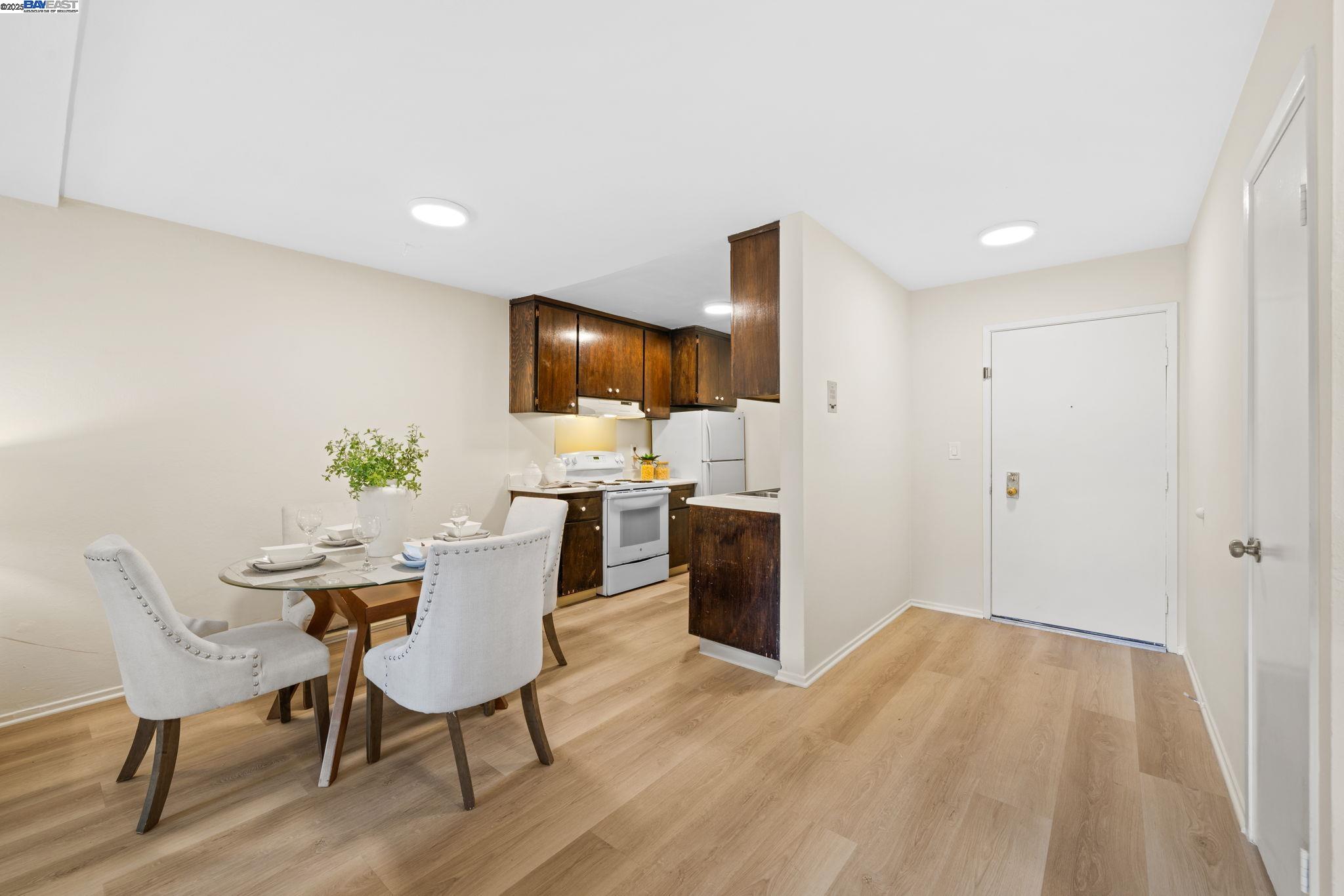 1327 Webster Street, Unit B101 Alameda, CA 94501 - Photo 14 of 26 a view of a dining room with furniture and wooden floor