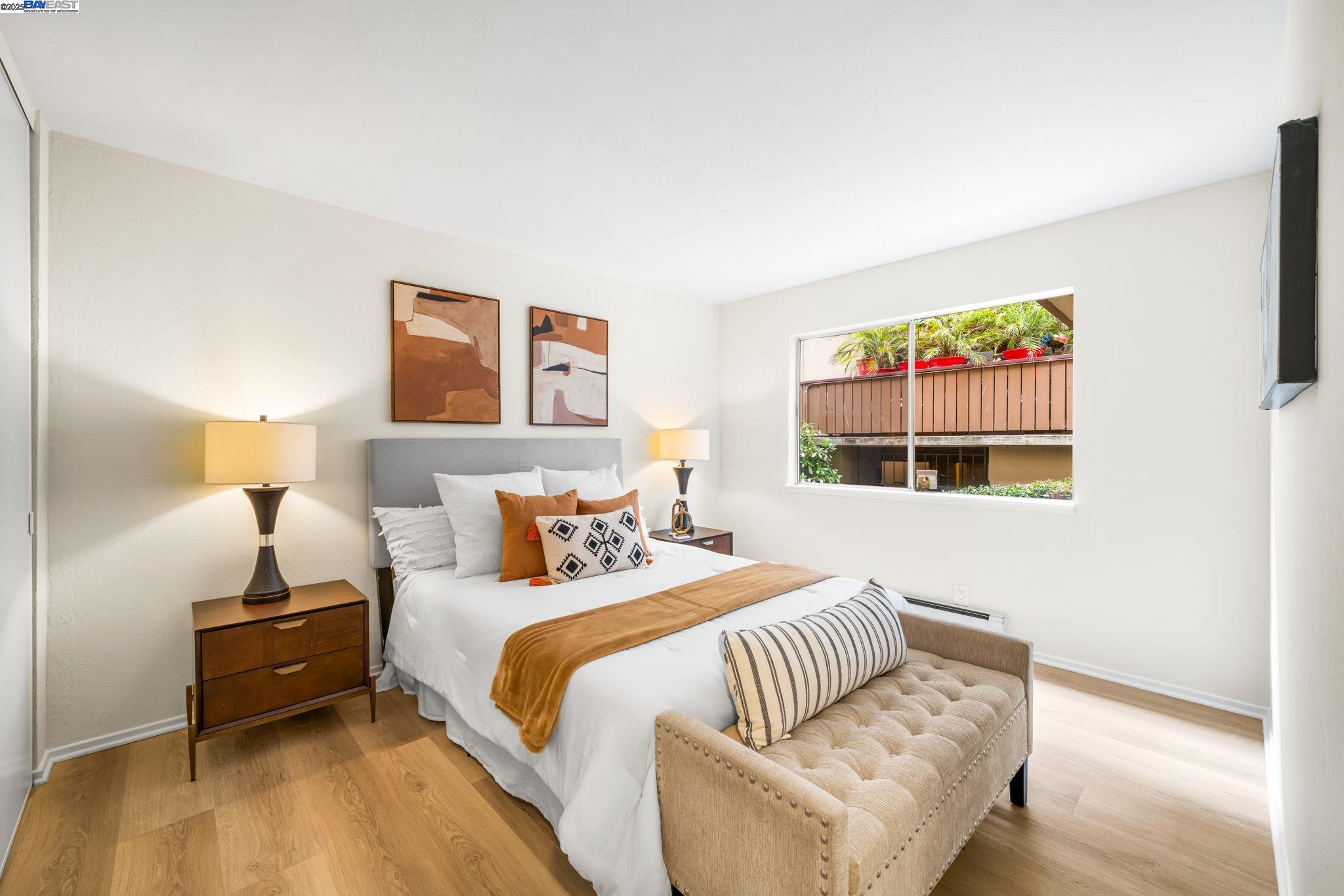 1327 Webster Street, Unit B101 Alameda, CA 94501 - Photo 15 of 26 a bedroom with a bed and a couch