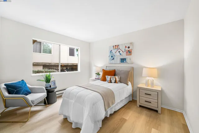 a bedroom with a bed and a couch