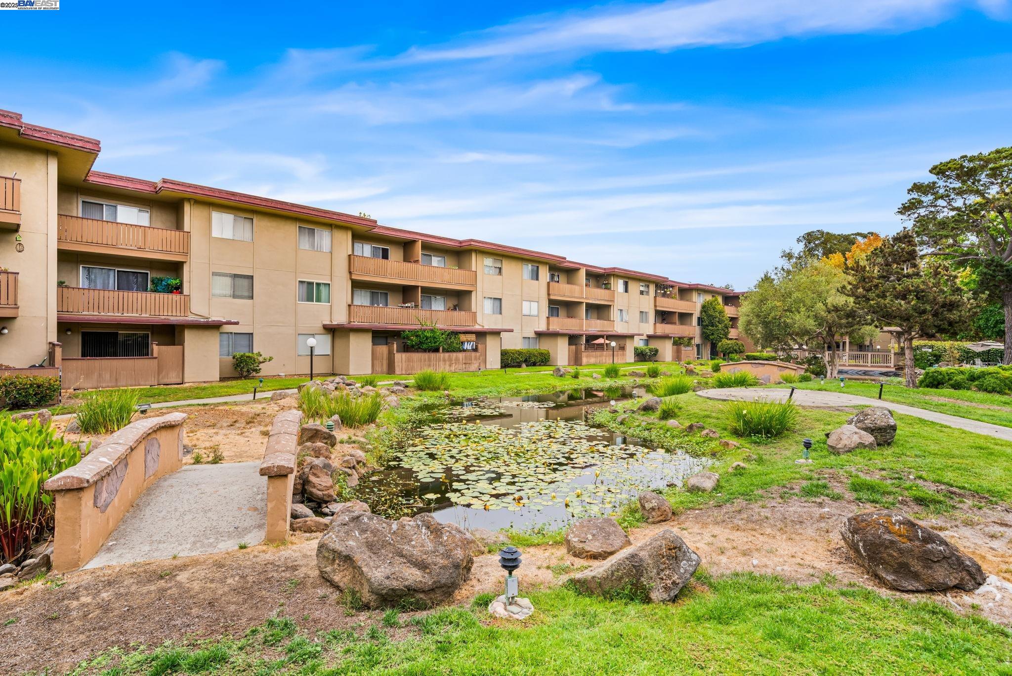 1327 Webster Street, Unit B101 Alameda, CA 94501 - Photo 22 of 26 a front view of a house with garden