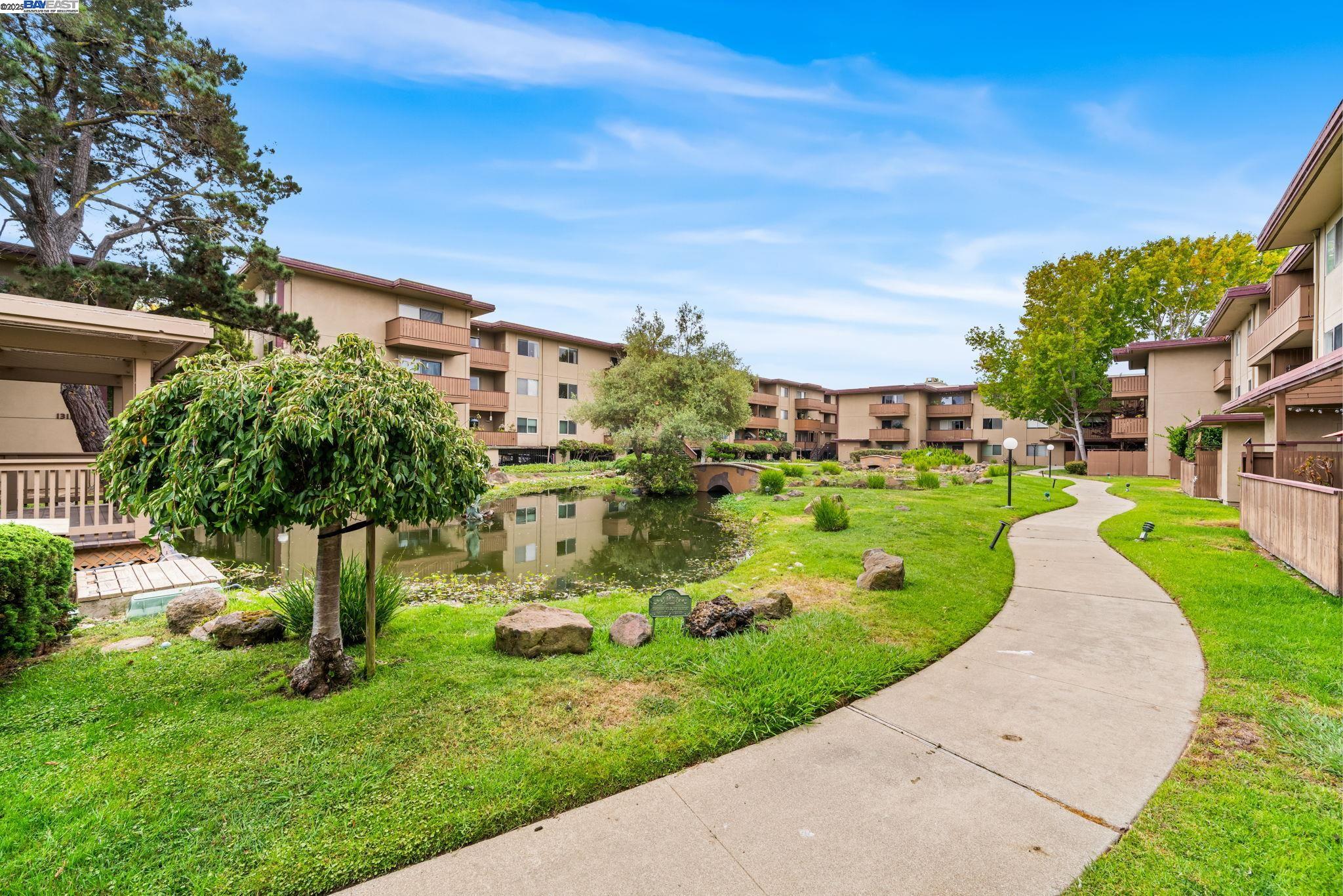 1327 Webster Street, Unit B101 Alameda, CA 94501 - Photo 24 of 26 a view of a garden with a building in the background