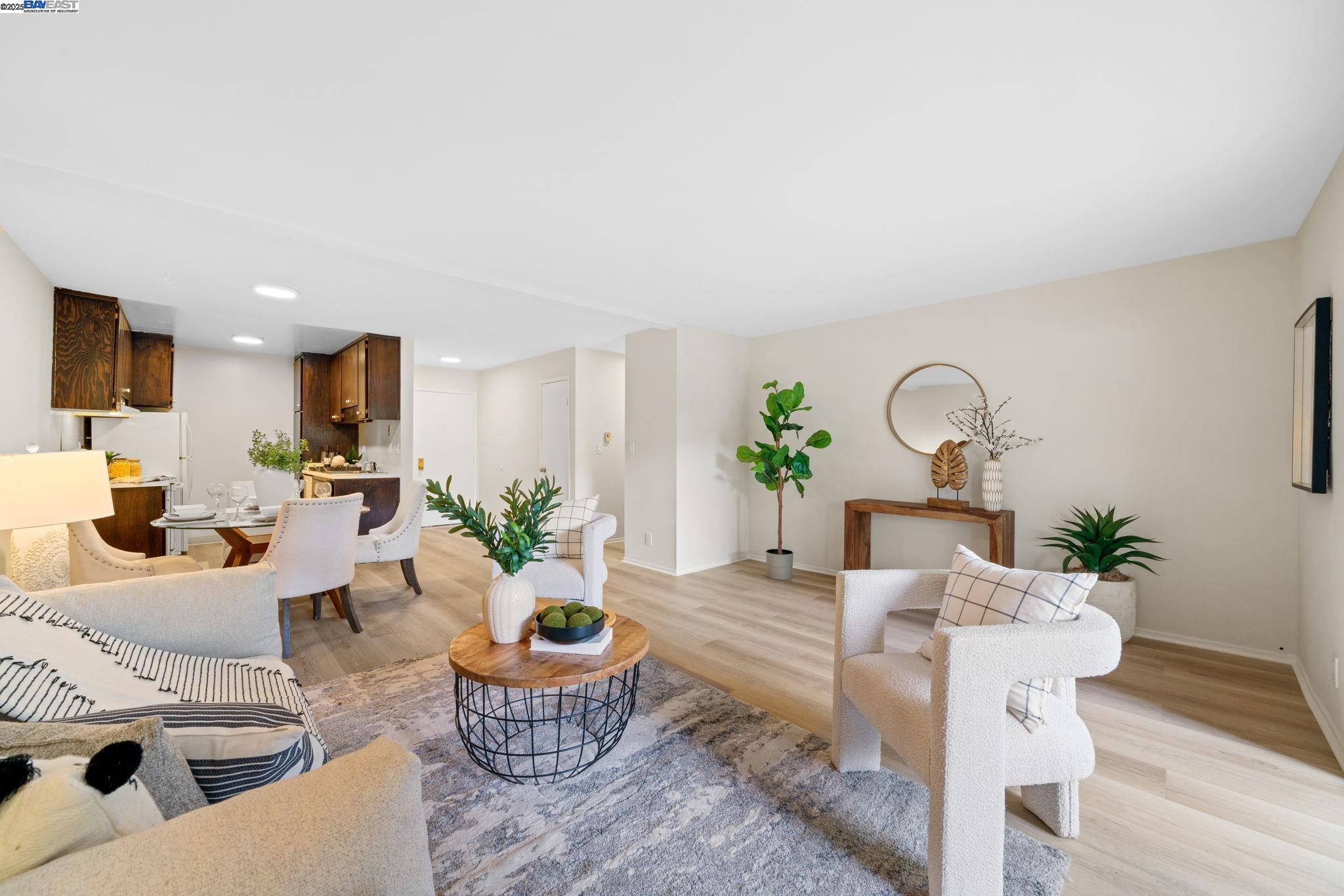 1327 Webster Street, Unit B101 Alameda, CA 94501 - Photo 4 of 26 a living room with furniture a potted plant and a fireplace