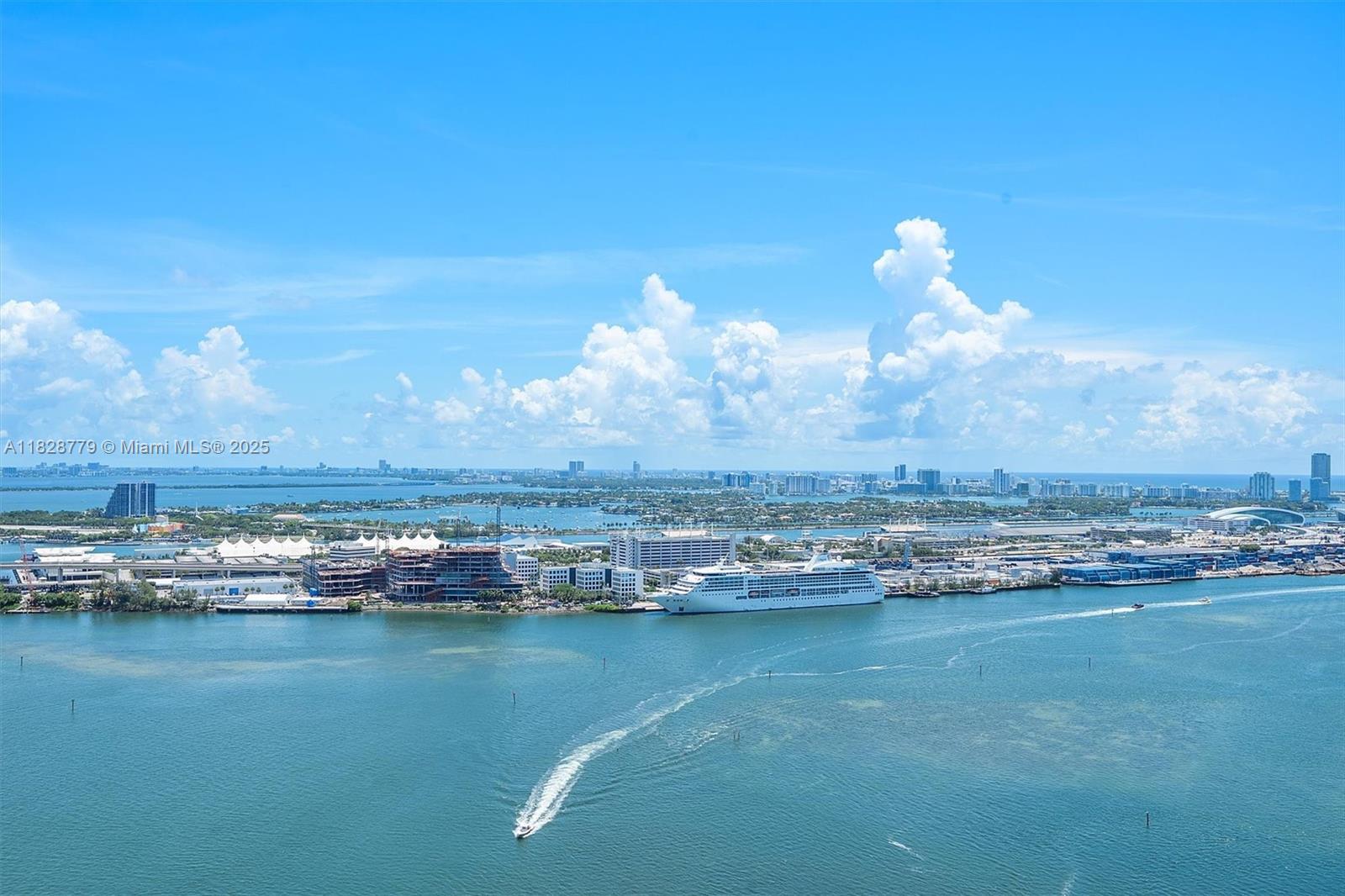 900 Brickell Key Boulevard, Unit 3103 Miami, FL 33131 - Photo 12 of 55 a view of a lake with houses in the back