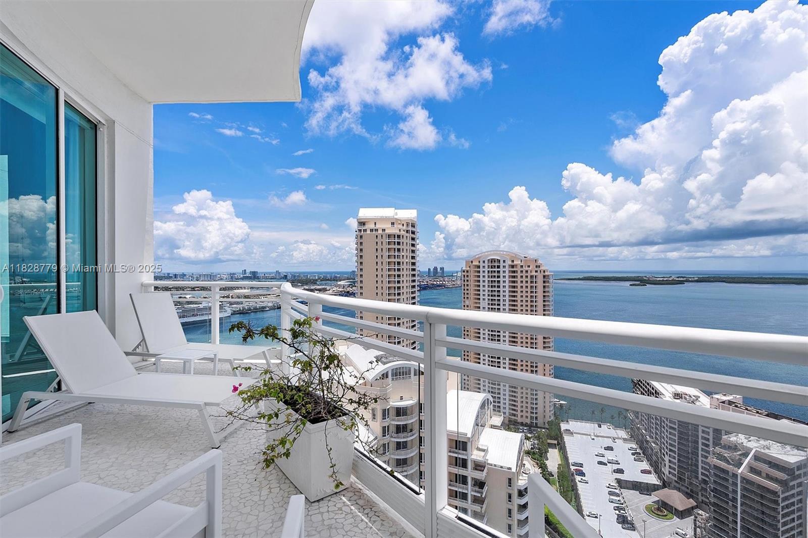 900 Brickell Key Boulevard, Unit 3103 Miami, FL 33131 - Photo 21 of 55 a view of a balcony with furniture