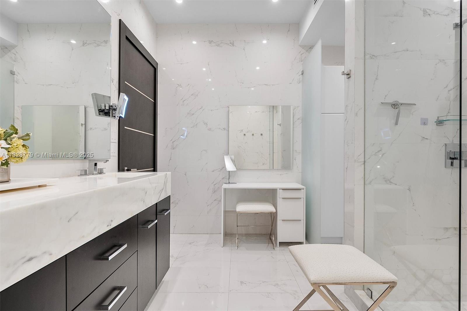 900 Brickell Key Boulevard, Unit 3103 Miami, FL 33131 - Photo 31 of 55 a bathroom with a double vanity sink mirror and shower