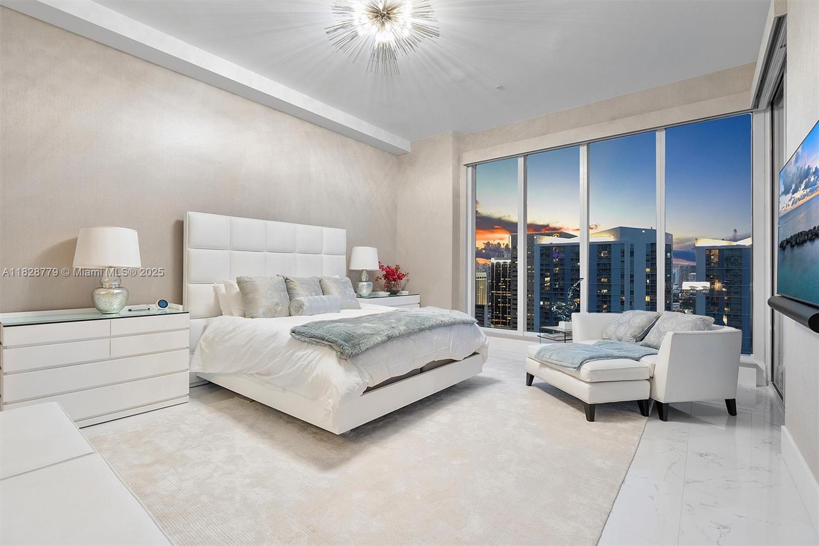 900 Brickell Key Boulevard, Unit 3103 Miami, FL 33131 - Photo 35 of 55 a living room with furniture and a large window