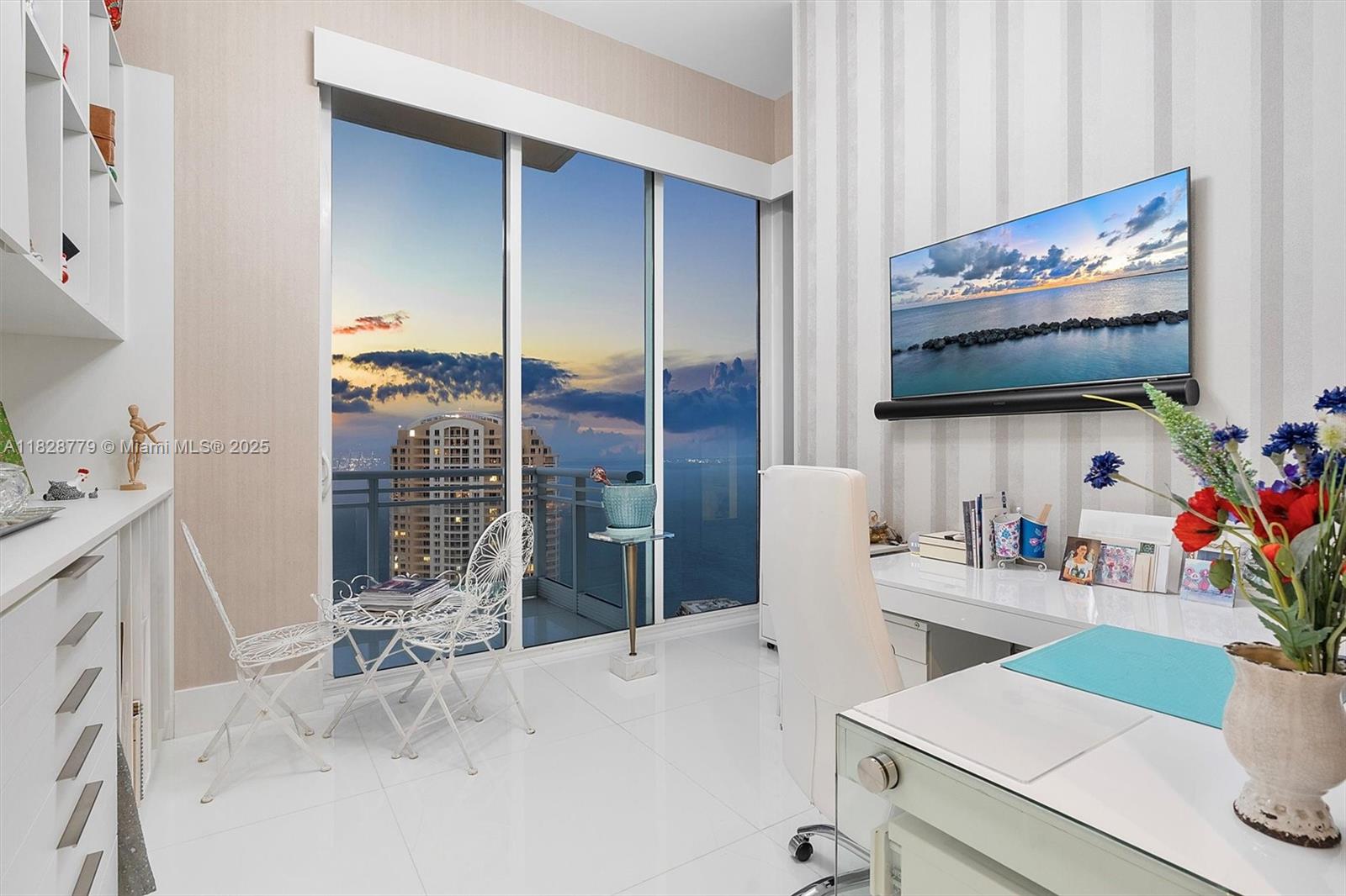 900 Brickell Key Boulevard, Unit 3103 Miami, FL 33131 - Photo 36 of 55 a room with furniture and flat screen tv