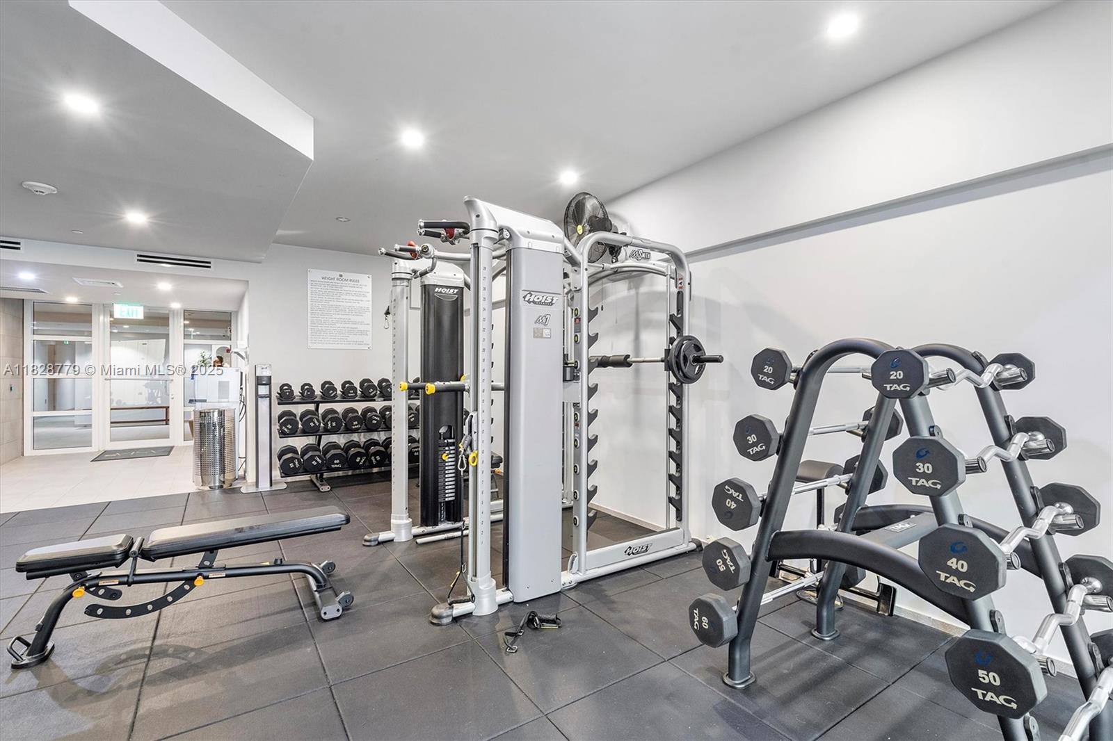 900 Brickell Key Boulevard, Unit 3103 Miami, FL 33131 - Photo 43 of 55 a view of a room with lots of white furniture