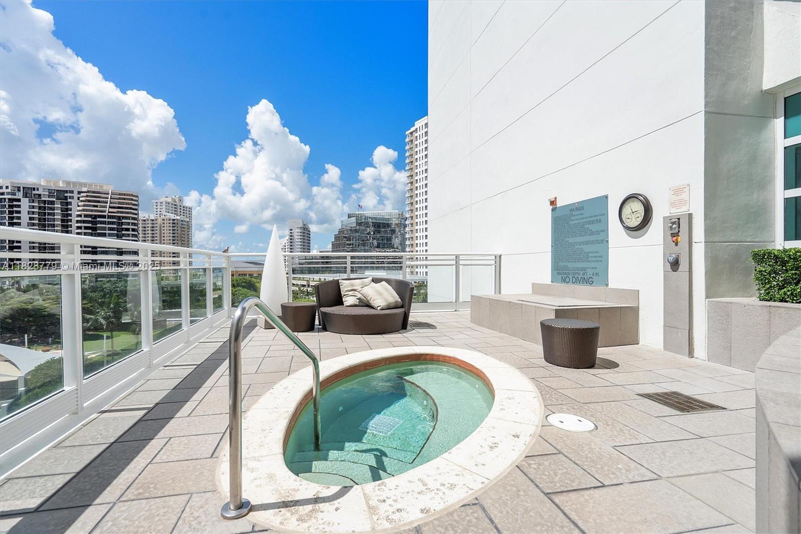 900 Brickell Key Boulevard, Unit 3103 Miami, FL 33131 - Photo 44 of 55 a view of a patio with couches chairs and potted plants